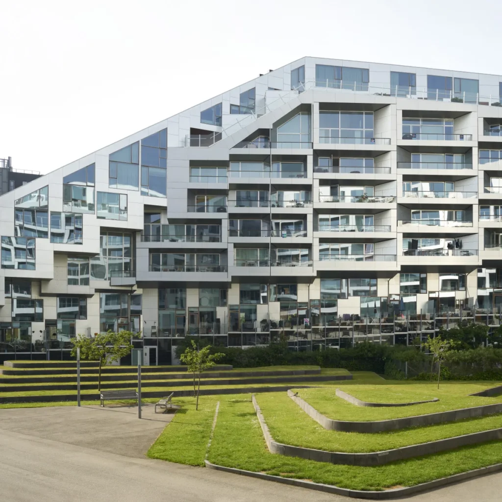 Detail of the trees and planting stairs of the inner courtyard of the 8 House by BIG /Bjarke Ingels Group