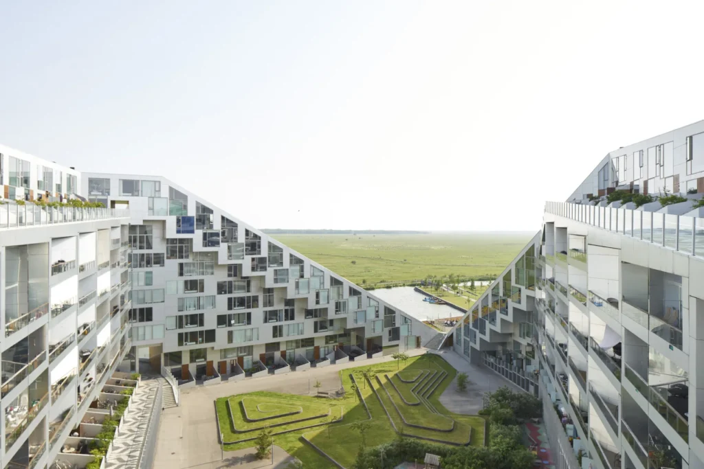 Stepped balconies along the sloping roofline of the 8 House by BIG / Bjarke Ingels Group