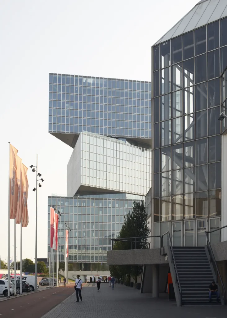 Ground floor and canopy of nHow Amsterdam RAI Hotel with flags