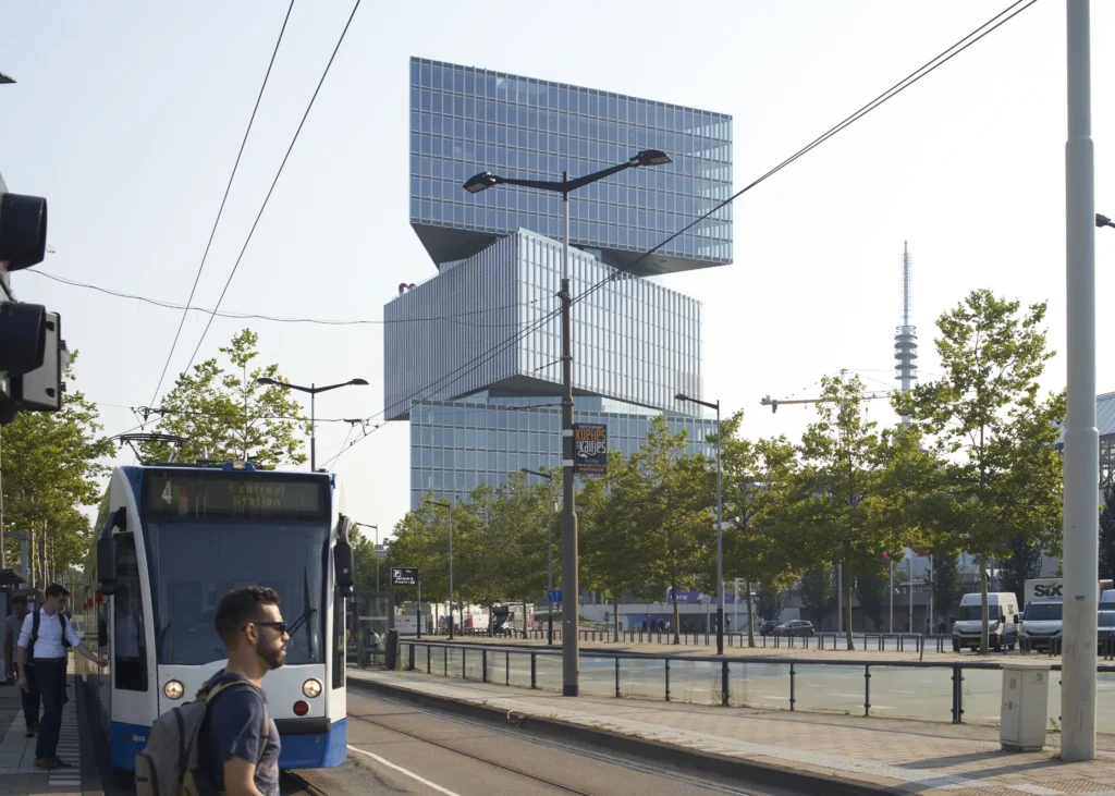 Amsterdam tram passing nHow RAI Hotel at street level by OMA