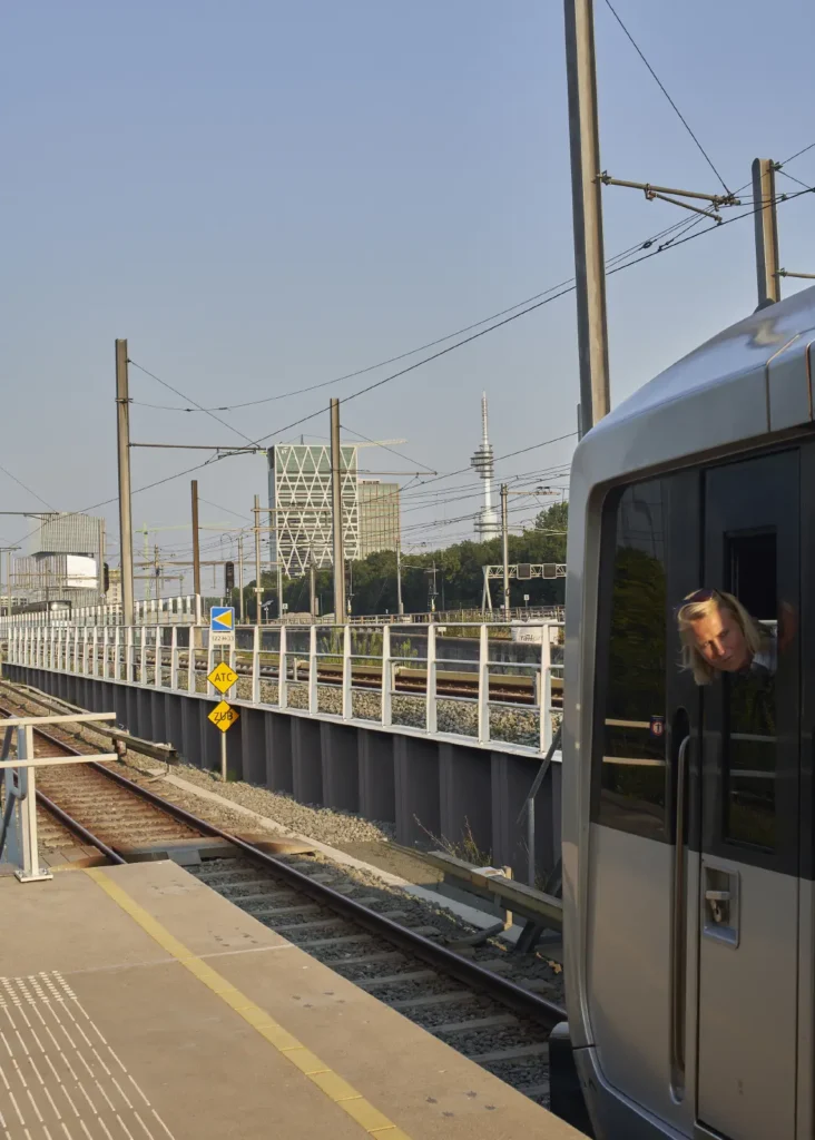 Traindriver looking back with OMA's nHow Amsterdam RAI Hotel in the distance