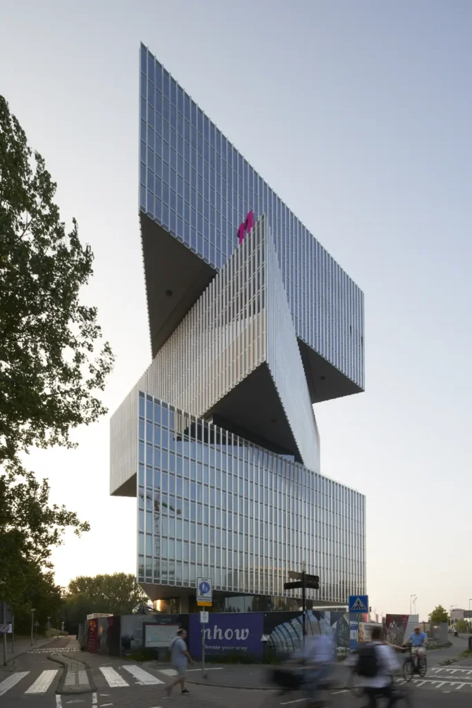 Three cantilevered volumes of nHow Amsterdam RAI Hotel by OMA seen from street level