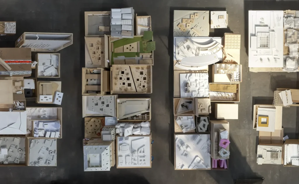 Aerial photograph of hundreds of cardboard and plaster models laid out for Barkow Leibinger exhibition