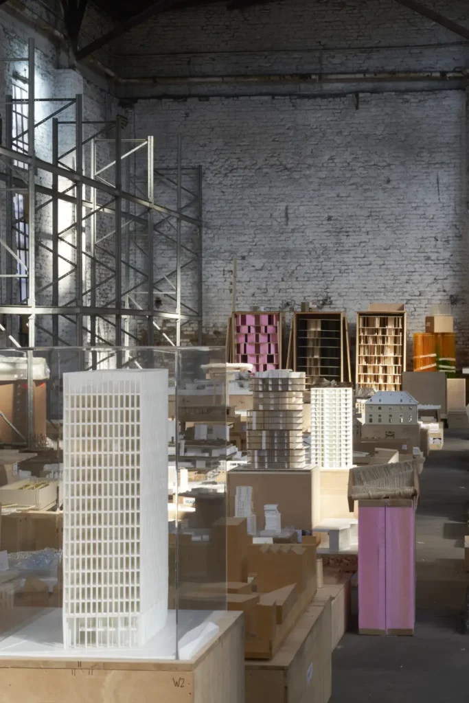 Colourful tower models with pink and orange accents in warehouse for Revolutions of Choice