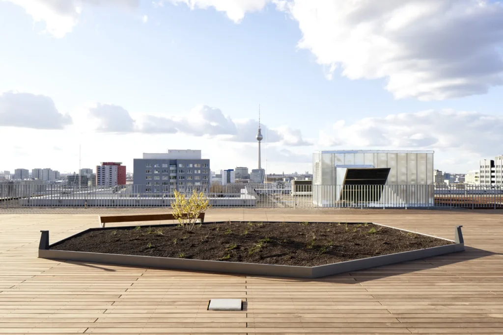 Rooftop terrace at UP! Berlin with planter beds and Fernsehturm in background