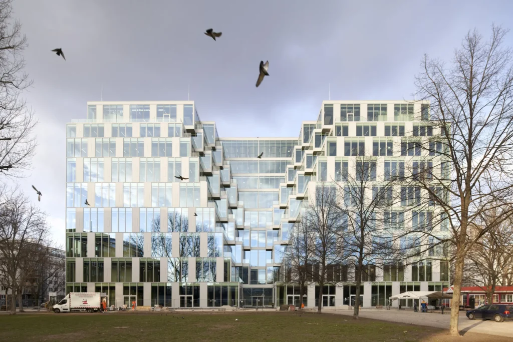Birda in the dramatic sky at transformed Centrum Warenhaus in Berlin by Jasper Architects