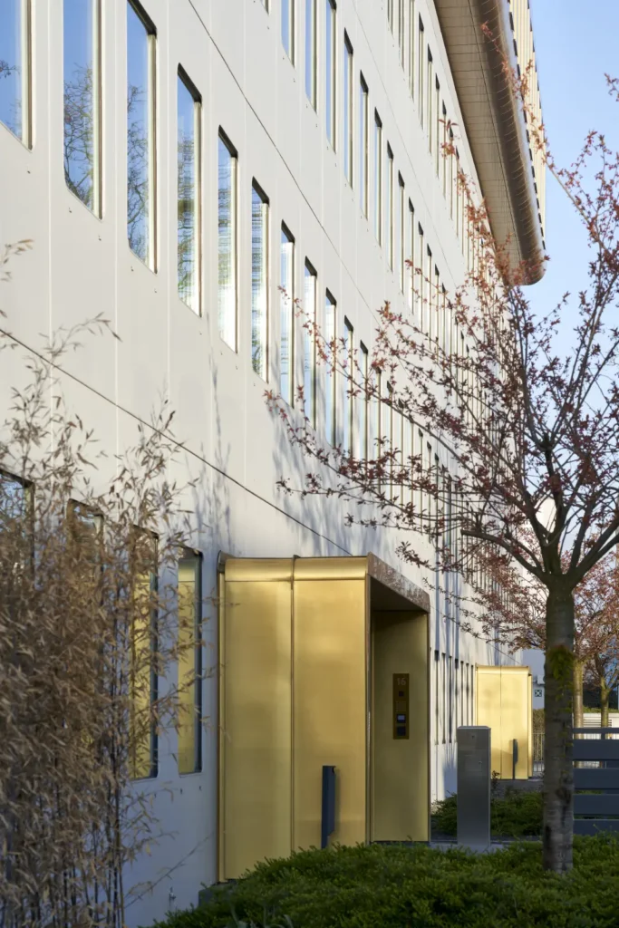 Gold anodised cladding entry detail on the rooftop addition of Werft16