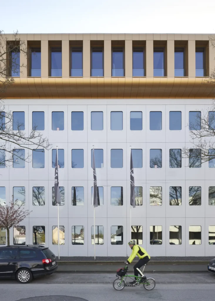 Cyclist passing the refurbished Werft16 building by Kresings in Düsseldorf