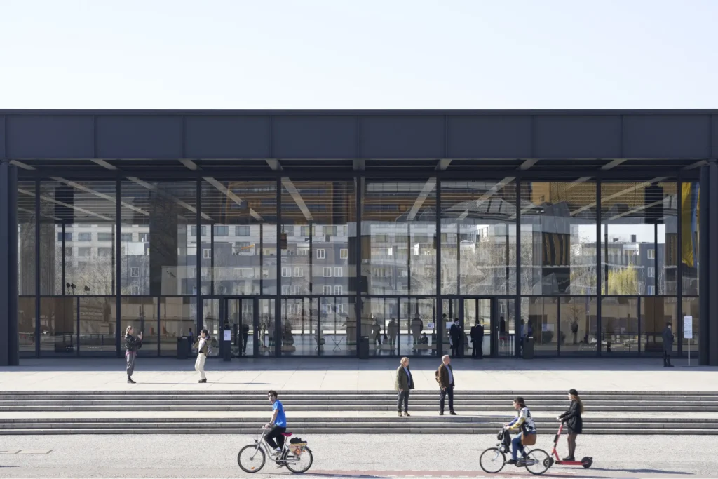 Cyclists passing the Neue Nationalgalerie on Potsdamer Strasse in Berlin