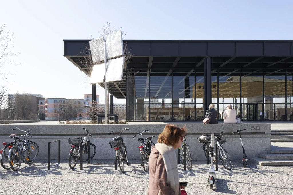 Visitors walking across the podium of the Neue Nationalgalerie in Berlin
