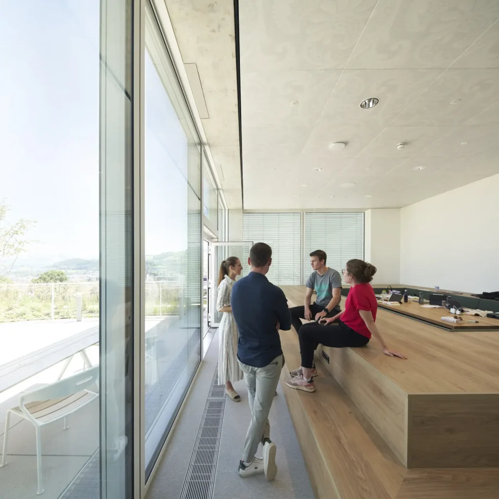 Informal seating and work area inside the SQUARE Learning Center by Sou Fujimoto
