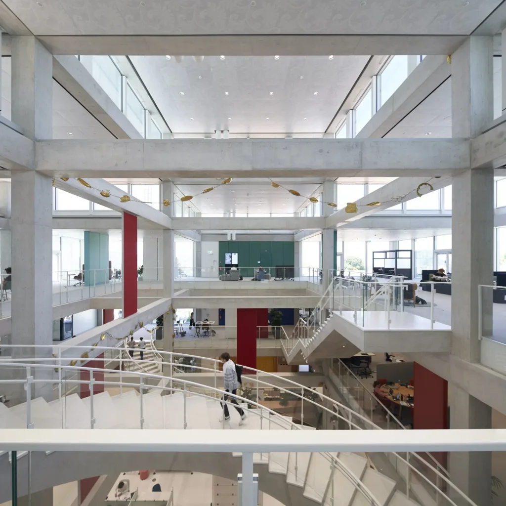 Open atrium with coloured accent walls inside the SQUARE Learning Center