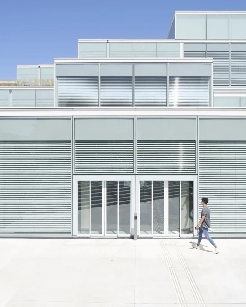 Man approaching the entrance of the SQUARE Learning Center in St. Gallen