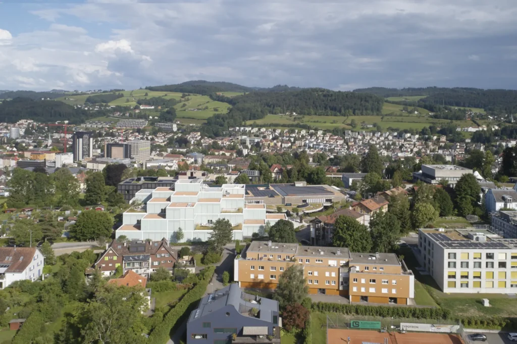 SQUARE Learning Center by Sou Fujimoto with St. Gallen town in the background