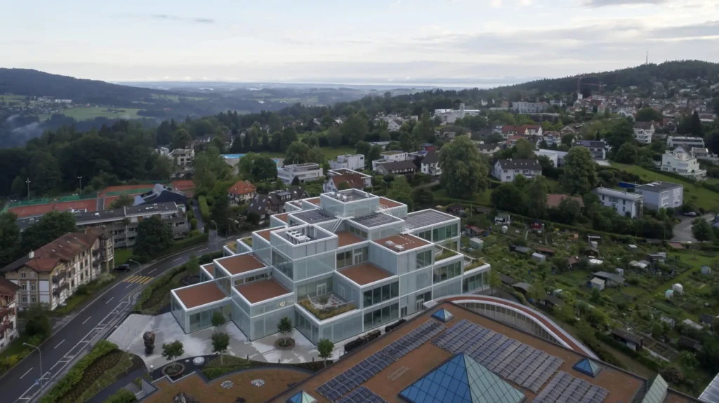 SQUARE Learning Center by Sou Fujimoto with St. Gallen town and Bodensee in the background