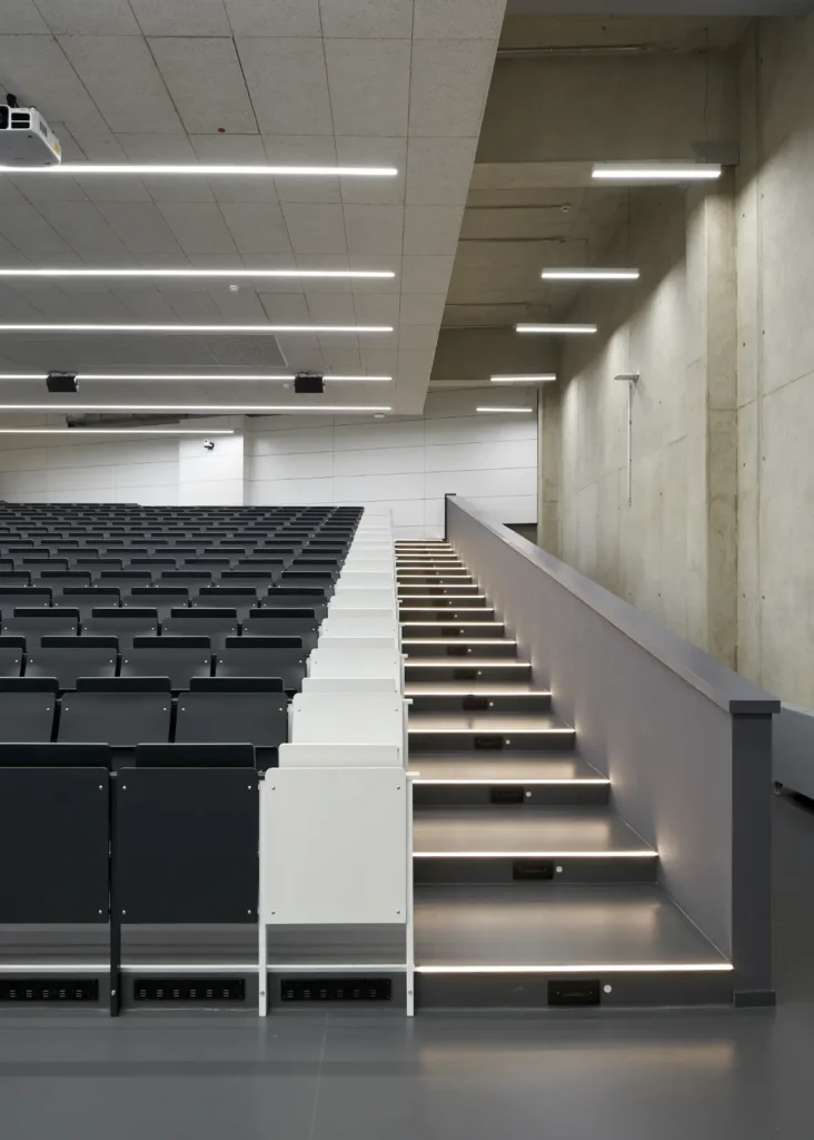 Lecture hall with illuminated stairs inside the KMAC Center for Advanced Mobility in Aachen