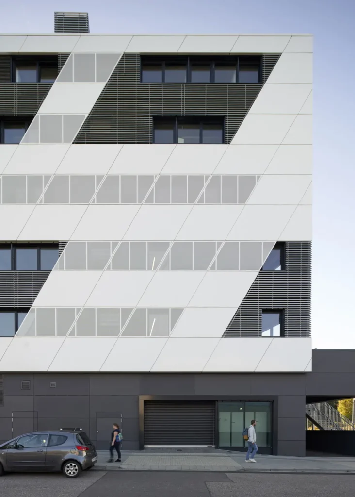 Abstract pattern of windows and louvres on the KMAC Center for Advanced Mobility with delivery entry