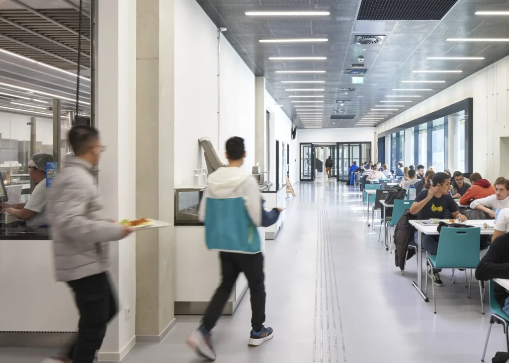 Seating area in the cafeteria of the KMAC building by studioMDA