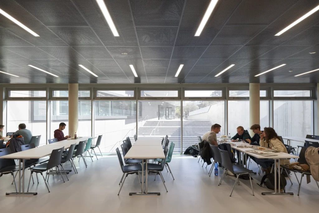 Seating area in the cafeteria of the KMAC building by studioMDA