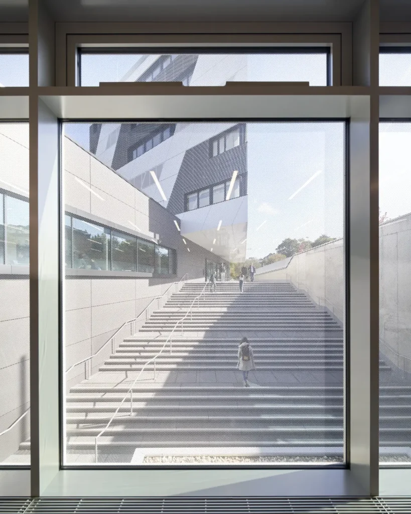 View through window above main stairs the two building volumes of the KMAC in Aachen