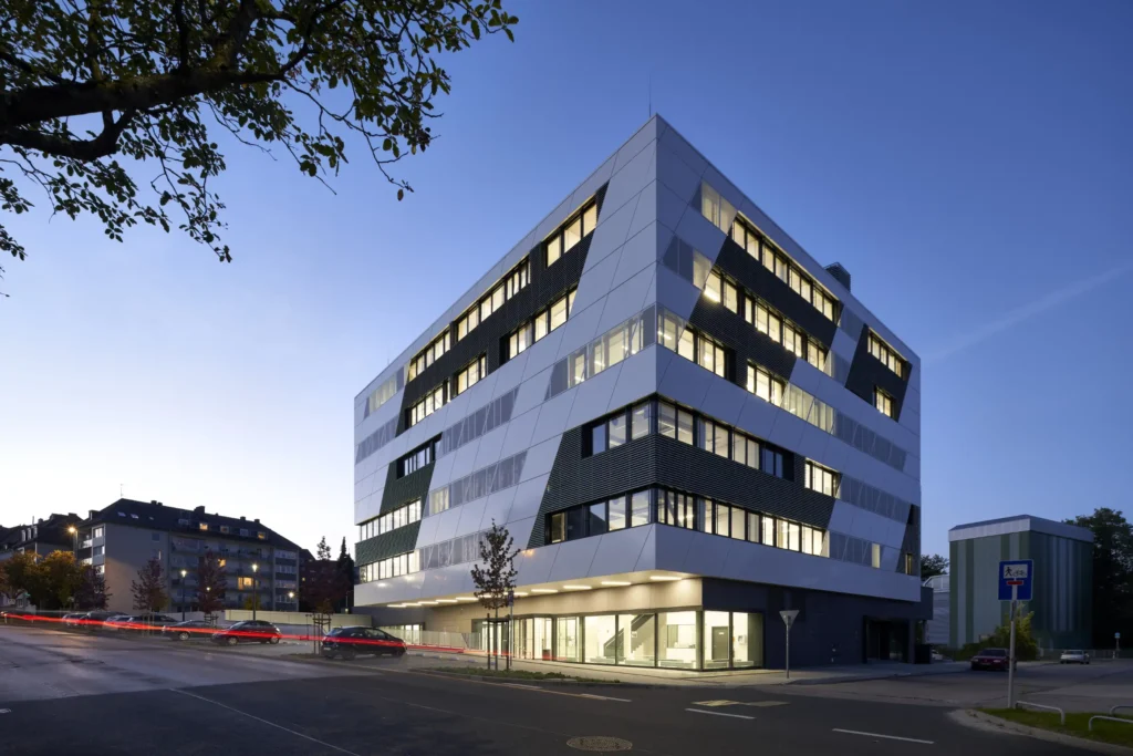 KMAC Center for Advanced Mobility illuminated at dusk in Aachen