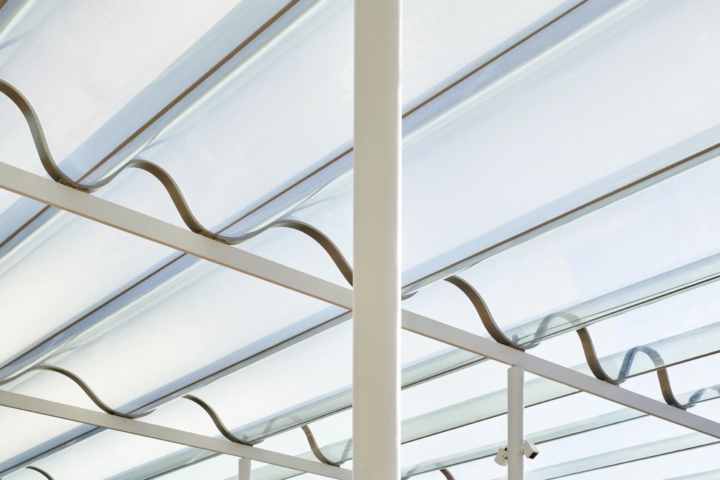 Undulating glass canopy with bronze wave supports at Sydney Modern by SANAA