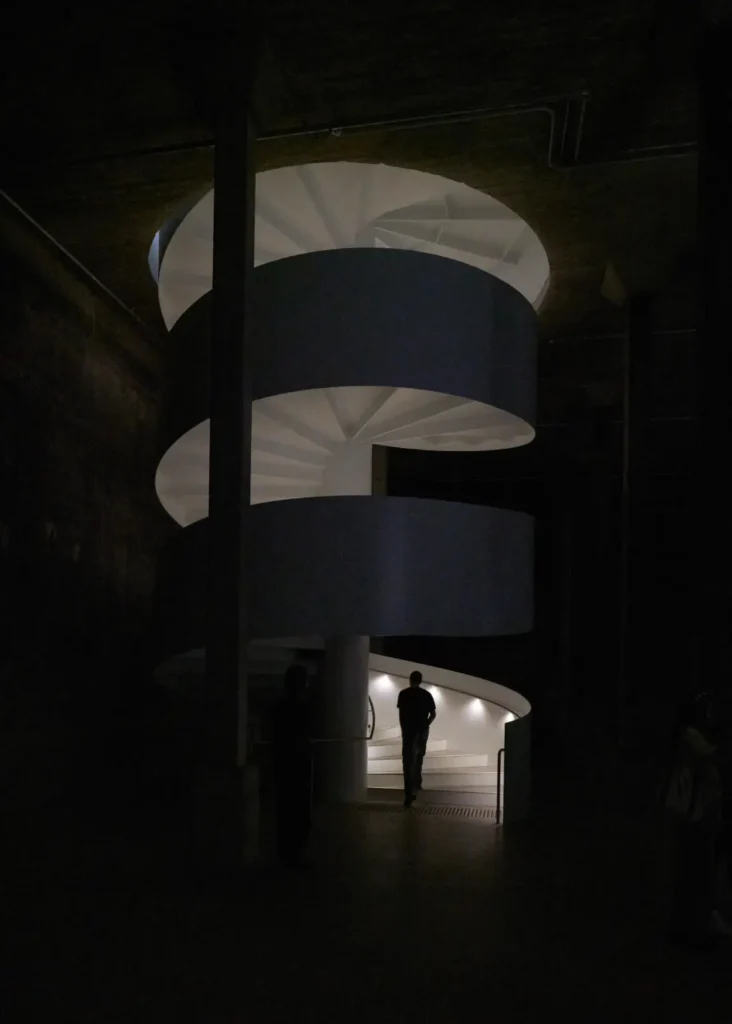 Sculptural spiral staircase connecting gallery levels at Sydney Modern by SANAA