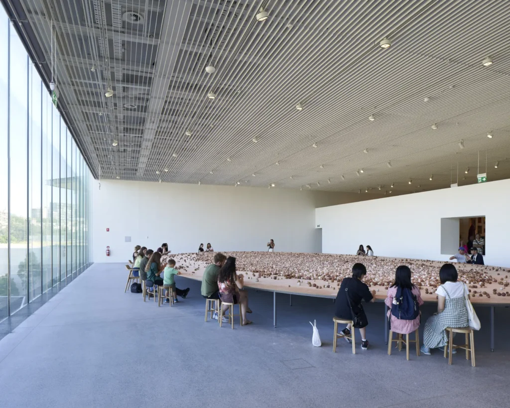 Light-filled gallery hall with coffered ceiling and full-height glazing at Sydney Modern