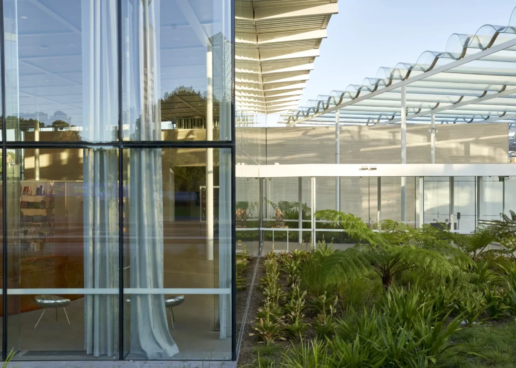 Glass and steel canopy sheltering sculpture terrace at Sydney Modern art gallery