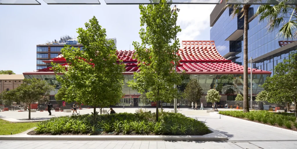 People walking past PHIVE Community Center on a sunny day in Parramatta Sydney