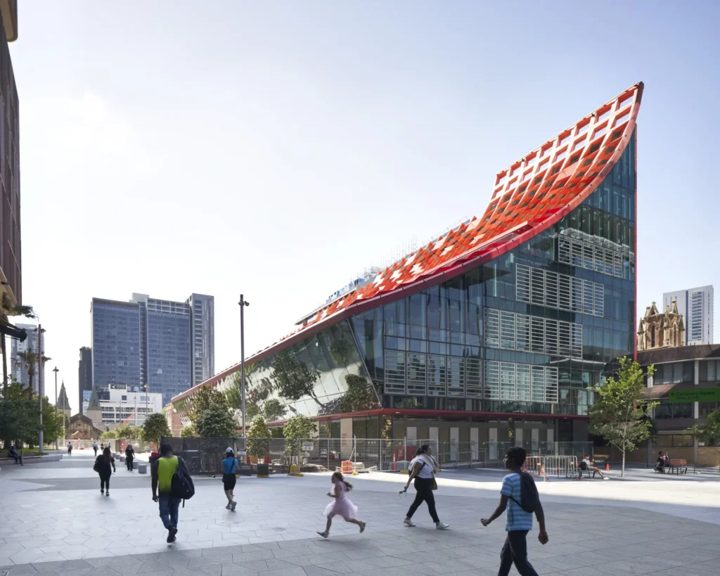 Pedestrians crossing Parramatta Square in front of PHIVE Community Center