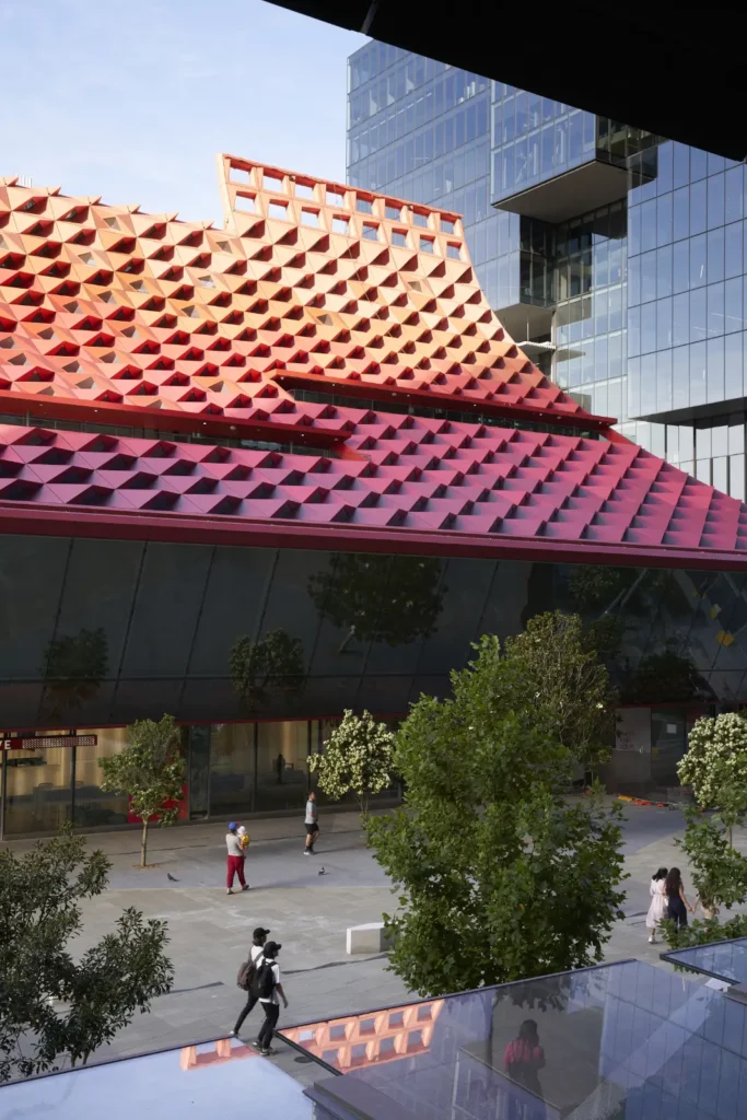 Pedestrians crossing Parramatta Square in front of PHIVE Community Center
