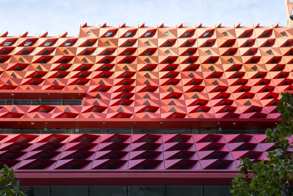 Detail of red and orange metal cladding on PHIVE roof structure Parramatta