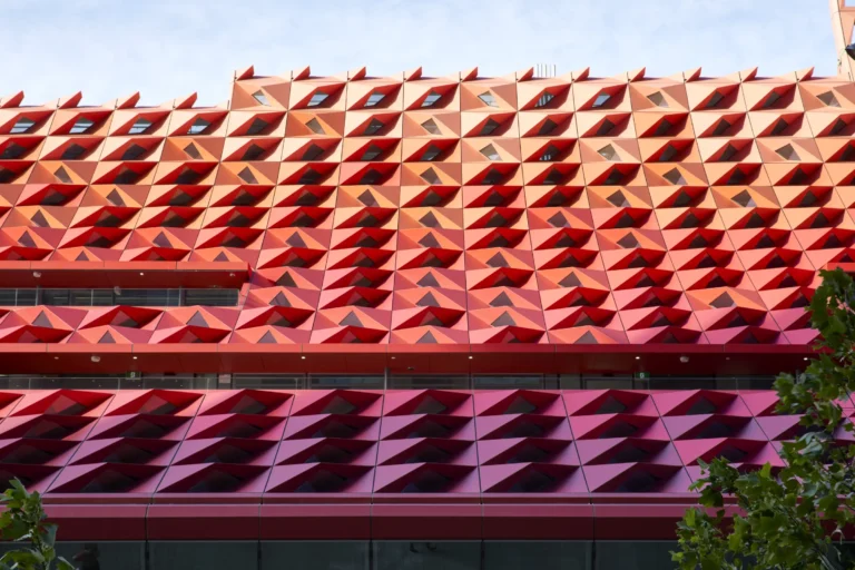 Detail of red and orange metal cladding on PHIVE roof structure Parramatta