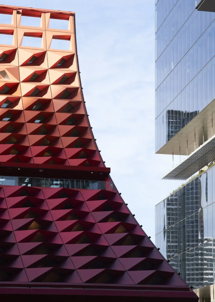 Red metal roof panel detail showing diamond fold pattern at PHIVE Parramatta