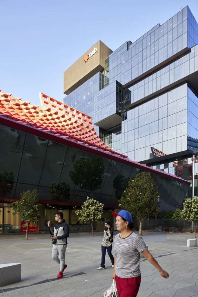 Pedestrians crossing Parramatta Square in front of PHIVE Community Center by Manuelle Gautrand