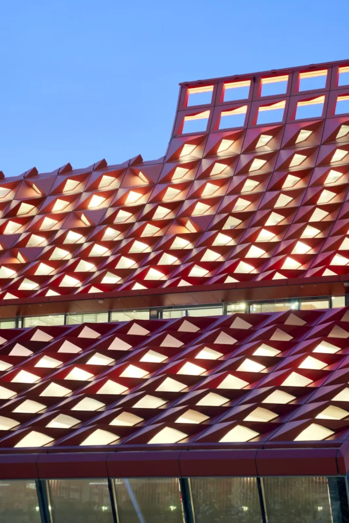 PHIVE Community Center roof structure illuminated at dusk in Parramatta Sydney