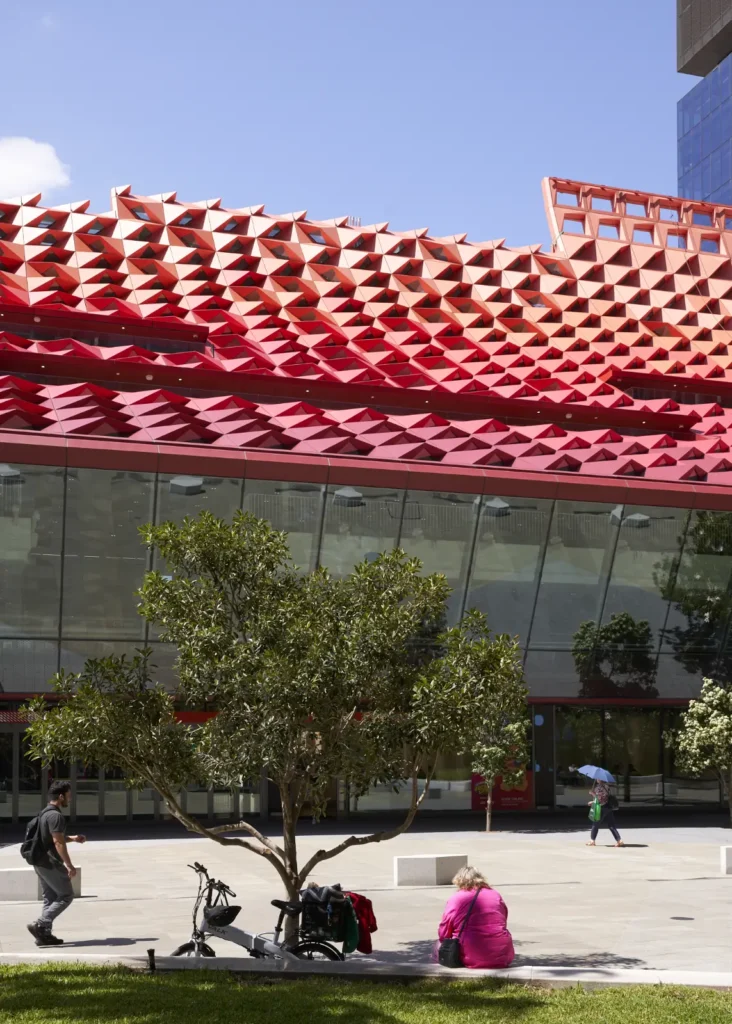 Glass and steel facade detail of PHIVE meeting the geometric roof structure