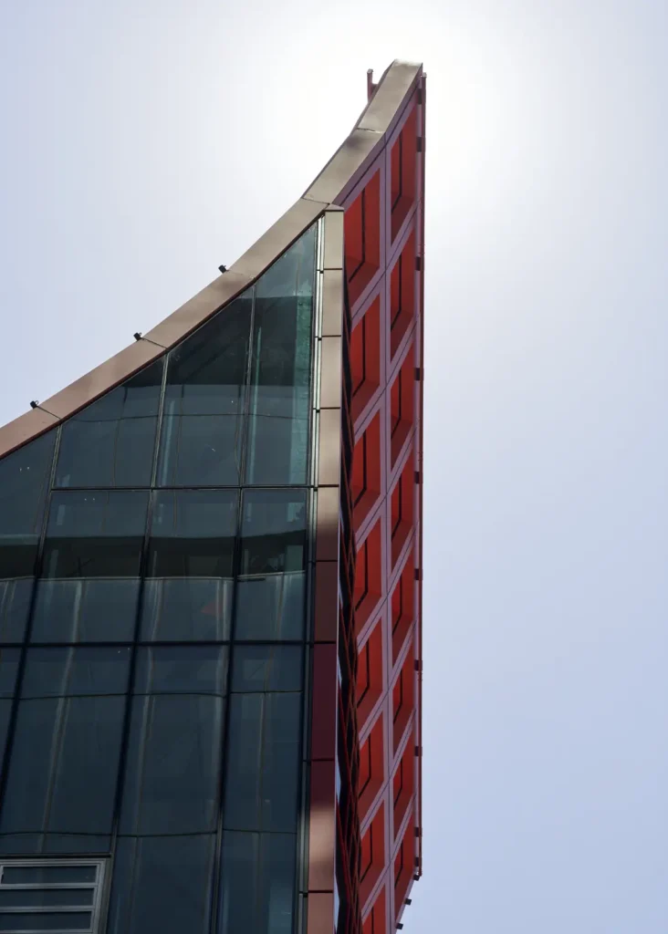 Glass and steel facade detail of PHIVE meeting the geometric roof structure
