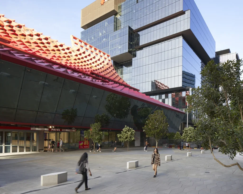 Pedestrians crossing Parramatta Square in front of PHIVE Community Center