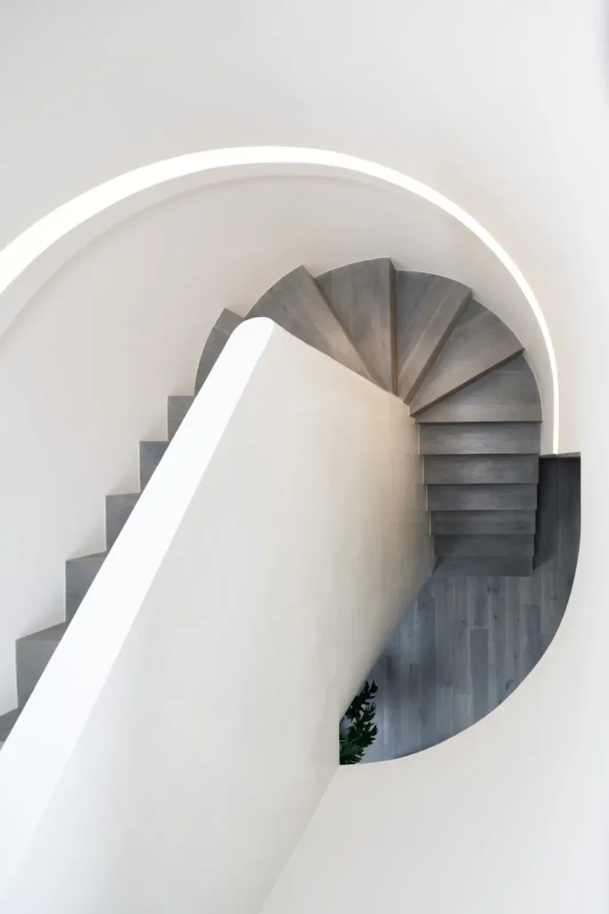 Spiral wooden staircase viewed from above at Alexandra Street house Melbourne