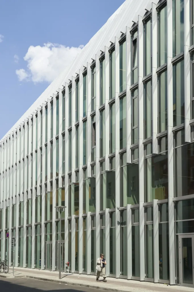 Vertical glass fin facade detail on Pressehaus podium building by GMP Architects