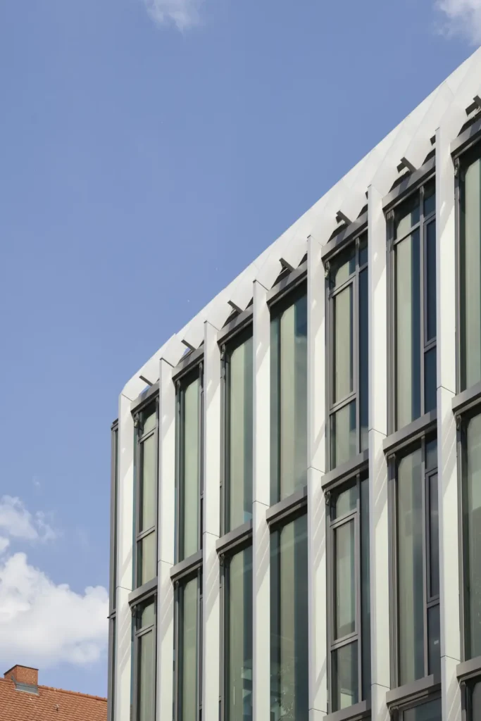 Vertical glass fin facade detail on Pressehaus podium building by GMP Architects