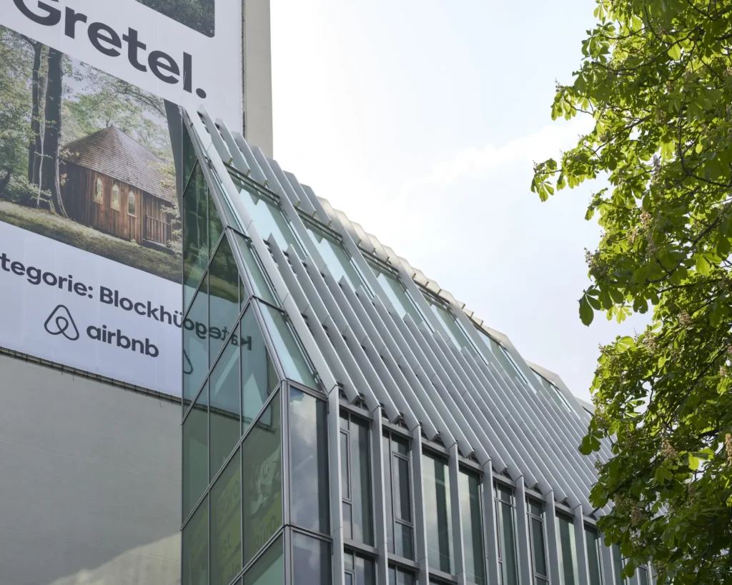 Vertical glass fin facade detail on Pressehaus podium building by GMP Architects