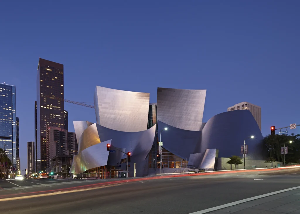 Late evening light reflecting off the stainless steel forms of Walt Disney Concert Hall at night