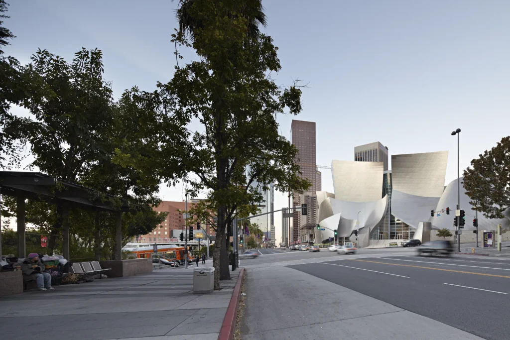 Early morning traffic on Grand Avenue with Walt Disney Concert Hall in the background