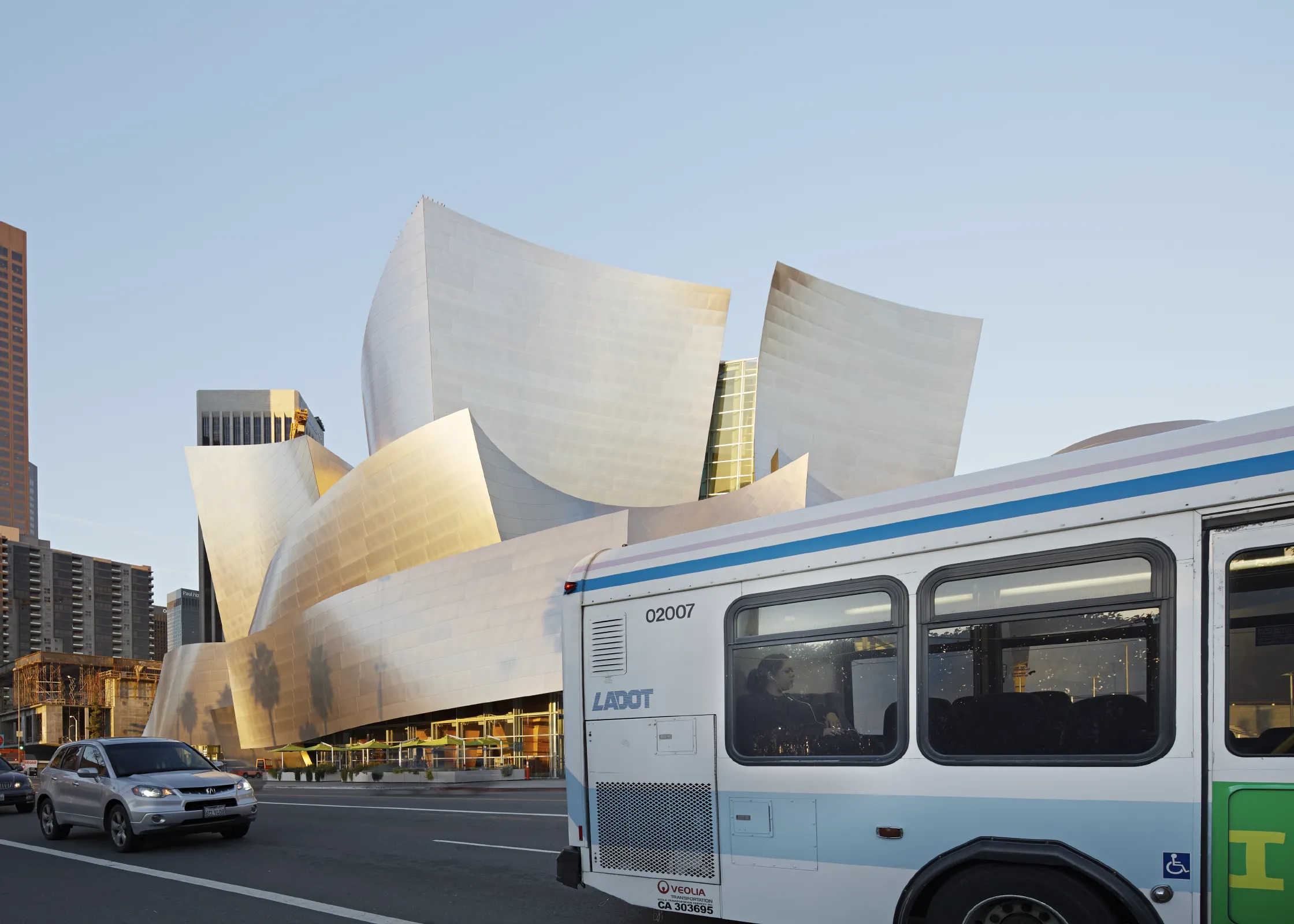 City bus passing Walt Disney Concert Hall on Grand Avenue in Los Angeles