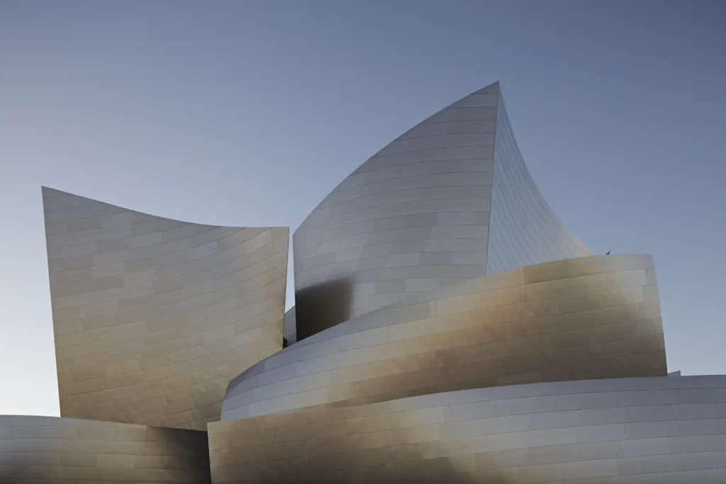 alt Disney Concert Hall under a deep blue evening sky in downtown Los Angeles