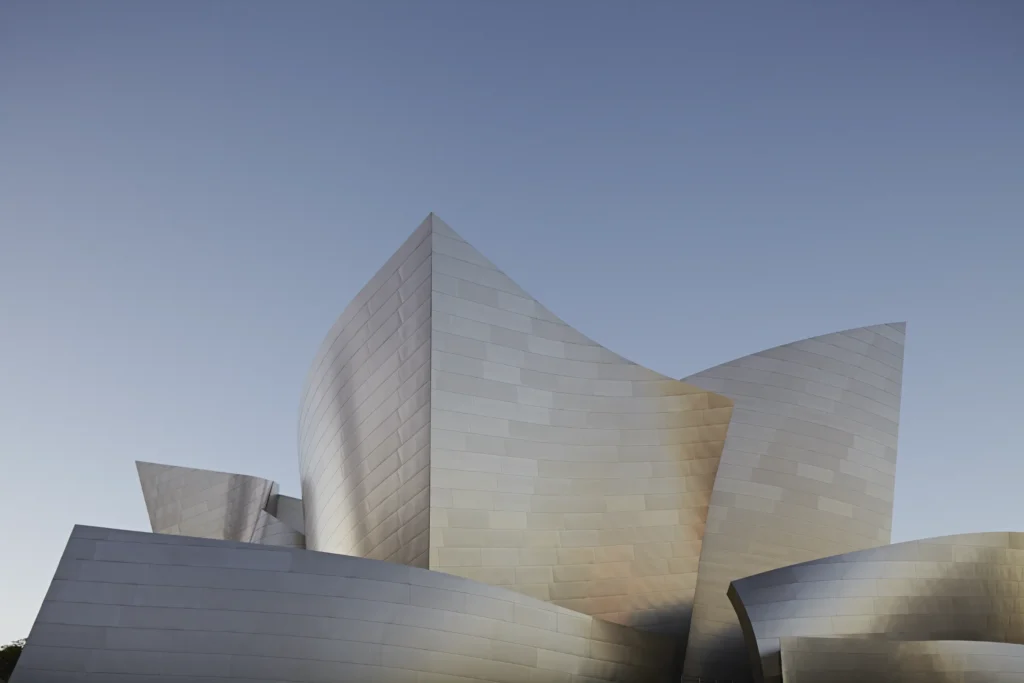 alt Disney Concert Hall under a deep blue evening sky in downtown Los Angeles