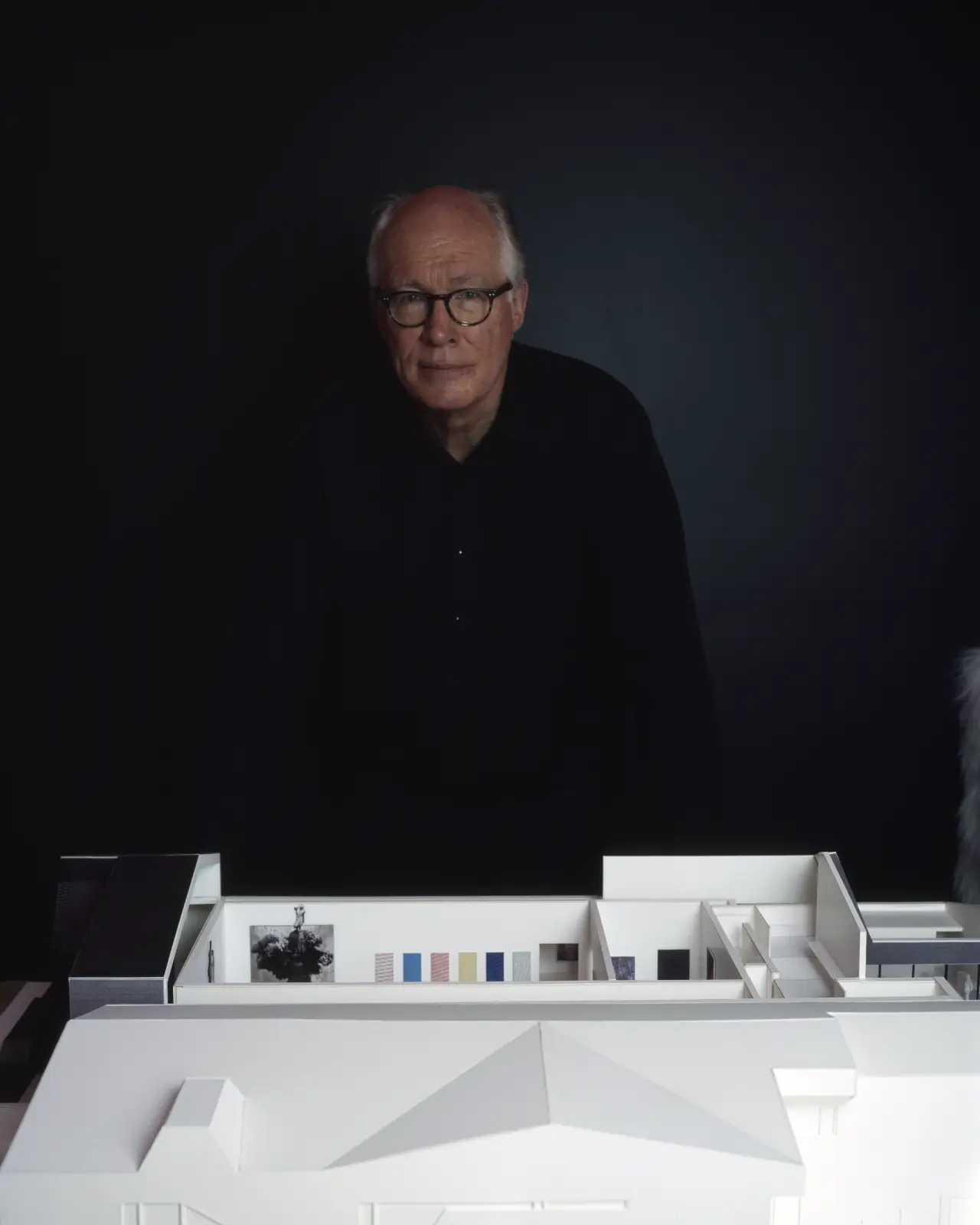 Corbett Lyon portrait in front of lyonhouse museum architecture model